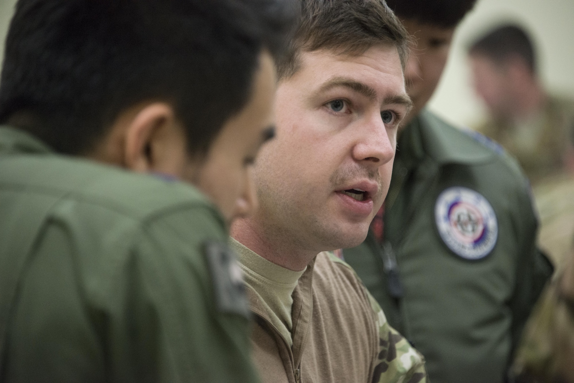 A U.S. Air Force 17th Special Operations Squadron pilot explains the mission plan for airborne operations with Republic of Korea Air Force 255th SOS aircrew, March 29, 2017 at Daegu Air Base, ROK. Foal Eagle 2017 provided an opportunity for the 353rd Special Operations Group to advance interoperability and increase partner capacity by planning and executing complex training missions with joint and combined counterparts. (U.S. Air Force photo by Capt. Jessica Tait)