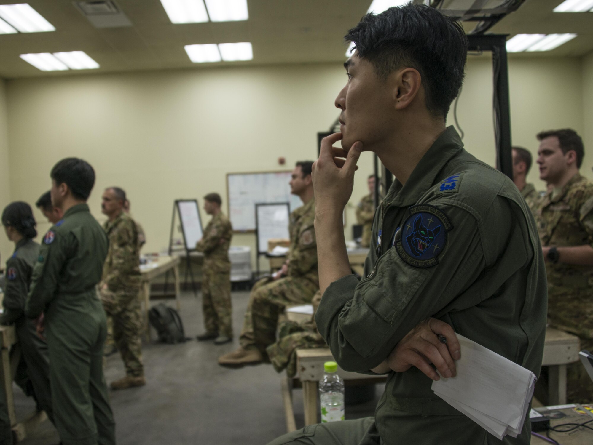 A Republic of Korea Air Force 255th Special Operations Squadron pilot listens during the mission briefing for airborne operation, March 31, 2017 at Daegu Air Base, ROK. The combined airborne operations performed during Foal Eagle 2017 reinforced the ROK-U.S. alliance and demonstrated one of the many alliance capabilities available for the defense of the ROK. (U.S. Air Force photo by Capt. Jessica Tait)