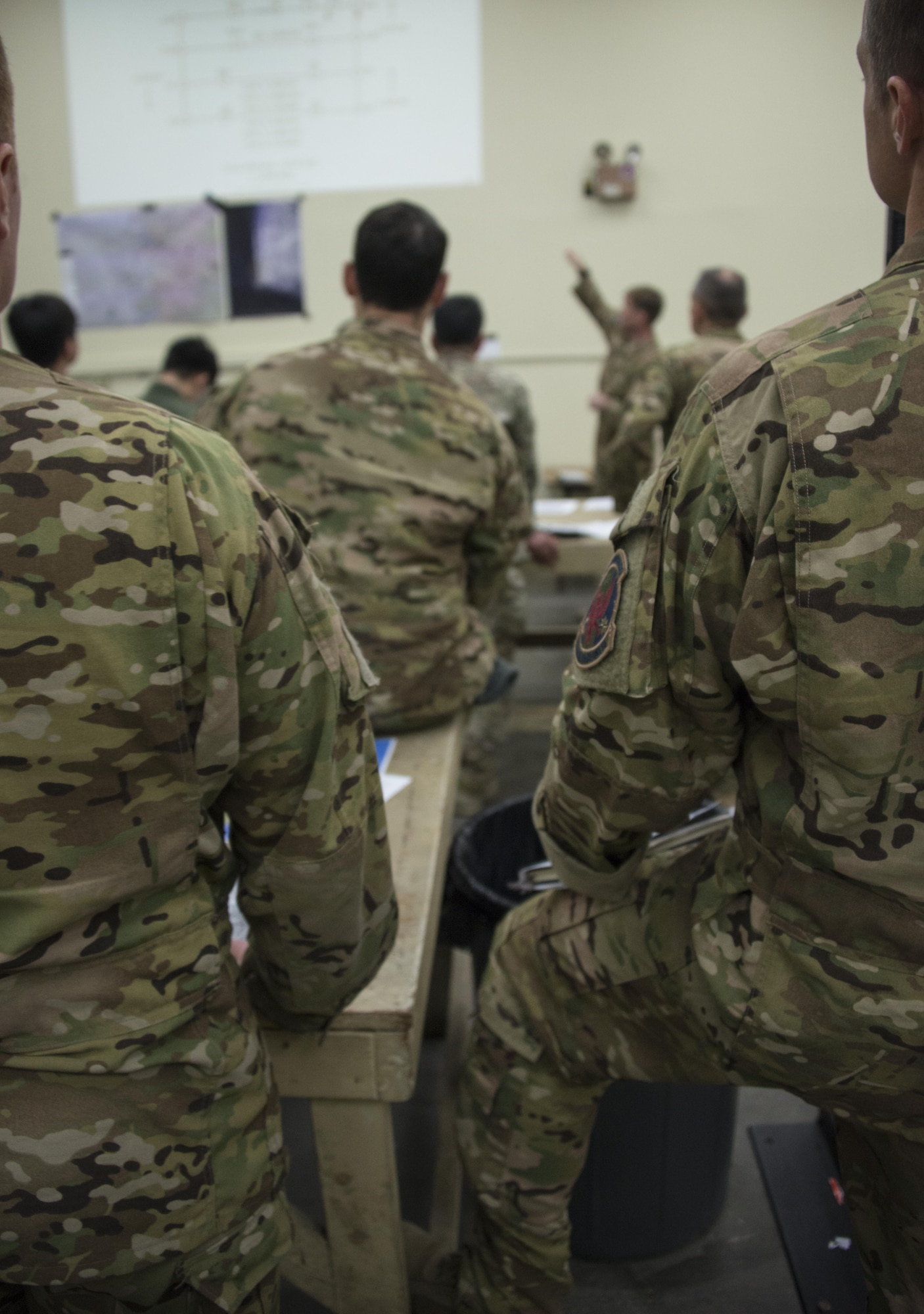 A U.S Air Force 1st Special Operations Squadron evaluator pilot delivers an airborne operations brief to aircrew and combat controllers from the Republic of Korea 255th SOS and 353rd Special Operations Group, March 31, 2017 at Daegu Air Base, ROK. The combined airborne operations performed during Foal Eagle 2017 reinforced the ROK-U.S. alliance and demonstrated one of the many alliance capabilities available for the defense of the ROK. (U.S. Air Force photo by Capt. Jessica Tait)