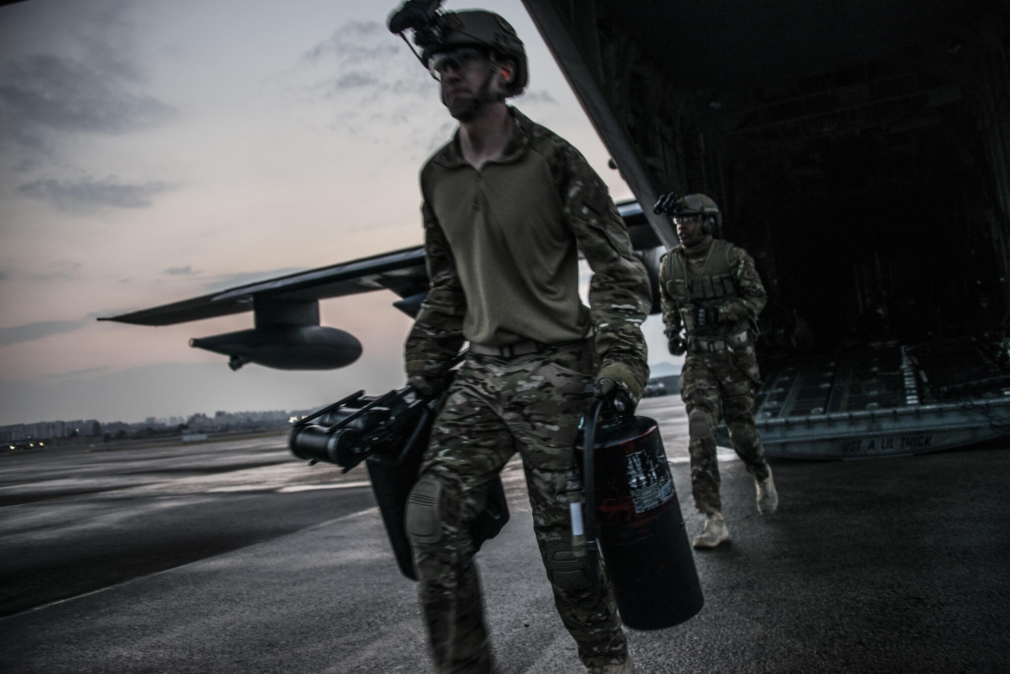 U.S. Air Force 18th Logistics Readiness Squadron forward area refueling point (FARP) technicians carry refueling equipment from a U.S. Air Force MC-130J Commando II assigned to the 17th Special Operations Squadron during a FARP operation, April 1, 2017 at Daegu Air Base, Republic of Korea. The FARP operations performed during Foal Eagle 2017 demonstrate the covert and nighttime refueling options available in situations where traditional refueling capabilities are not feasible. (U.S. Air Force photo by Capt. Jessica Tait)