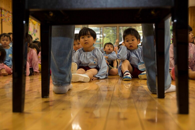 Josho Hoikuen Preschool students meet volunteers with the Marine Memorial Chapel during a community relations event in Iwakuni City, Japan, May 9, 2017. Volunteering at the preschool helped the relationship between Marine Corps Air Station Iwakuni residents and the local community grow stronger. Introductions were given by the volunteers while students asked them questions, then the children were introduced to “The Hokey Pokey” and “Head, Shoulders, Knees and Toes” before playing educational games with the volunteers. (U.S. Marine Corps photo by Lance Cpl. Gabriela Garcia-Herrera)