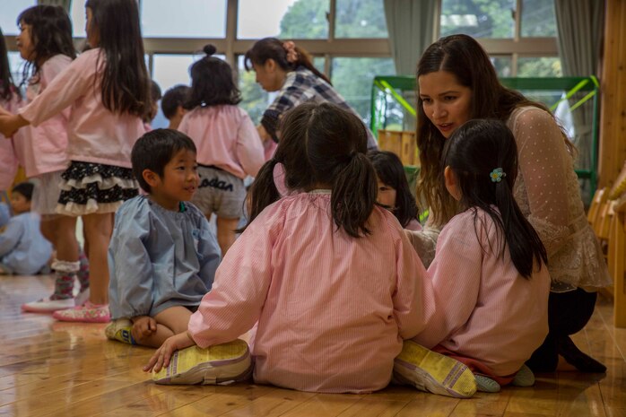 Michelle Hene, a volunteer with the Marine Memorial Chapel, plays games with Josho Hoikuen Preschool students during a community relations event in Iwakuni City, Japan, May 9, 2017. Volunteering at the preschool helped the relationship between Marine Corps Air Station Iwakuni residents and the local community grow stronger. Introductions were given by the volunteers while students asked them questions, then the children were introduced to “The Hokey Pokey” and “Head, Shoulders, Knees and Toes” before playing educational games with the volunteers. (U.S. Marine Corps photo by Lance Cpl. Gabriela Garcia-Herrera)
