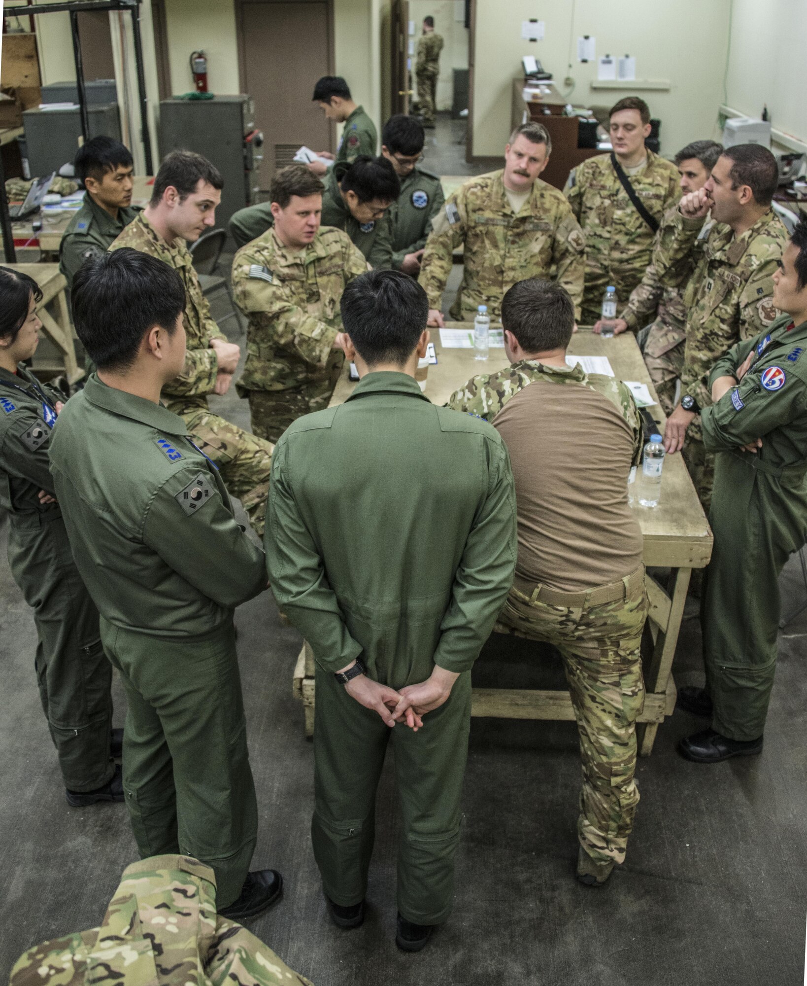 Aircrew from the U.S. Air Force 17th Special Operations Squadron and Republic of Korea 255th SOS meet for mission planning prior to flying operations, March 29, 2017 at Daegu Air Base, ROK. Foal Eagle 2017 provided an opportunity for the 1st SOS and 17th SOS and to advance interoperability and increase partner capacity by planning and executing complex training missions. (U.S. Air Force photo by Capt. Jessica Tait)