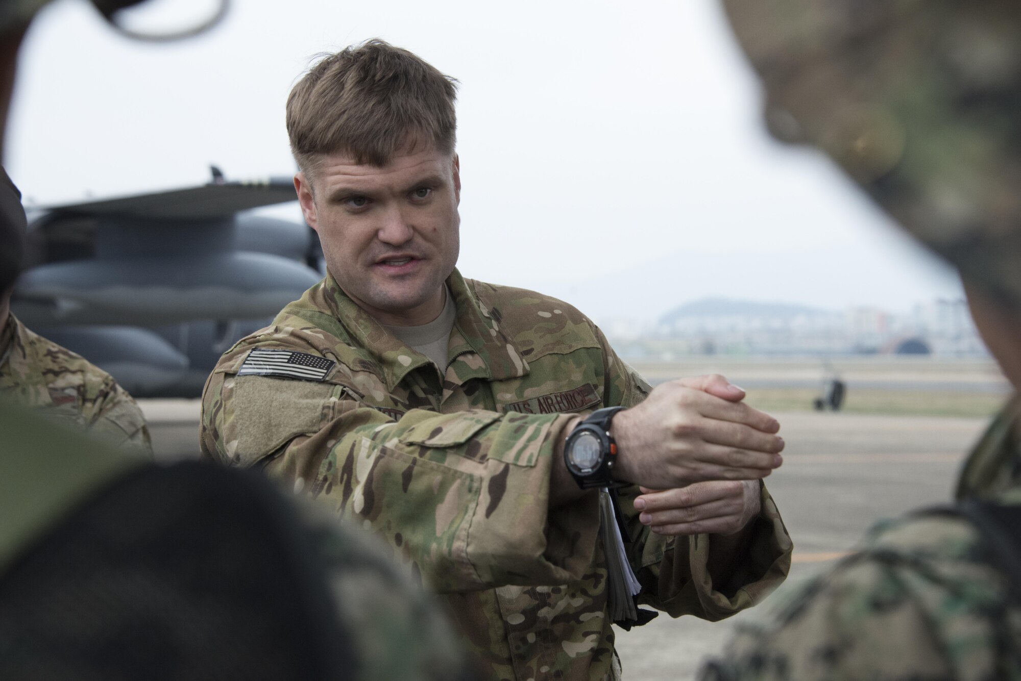 U.S. Air Force 1st Special Operations Squadron evaluator pilot explains how the formation of five U.S. Air Force MC-130s and one Republic of Korea Air Force C-130 will maneuver during a combined airborne operation, March 31, 2017 at Daegu Air Base, ROK. The combined airborne operations performed during Foal Eagle 2017 reinforced the ROK-U.S. alliance and demonstrated one of the many alliance capabilities available for the defense of the ROK. (U.S. Air Force photo by Capt. Jessica Tait)