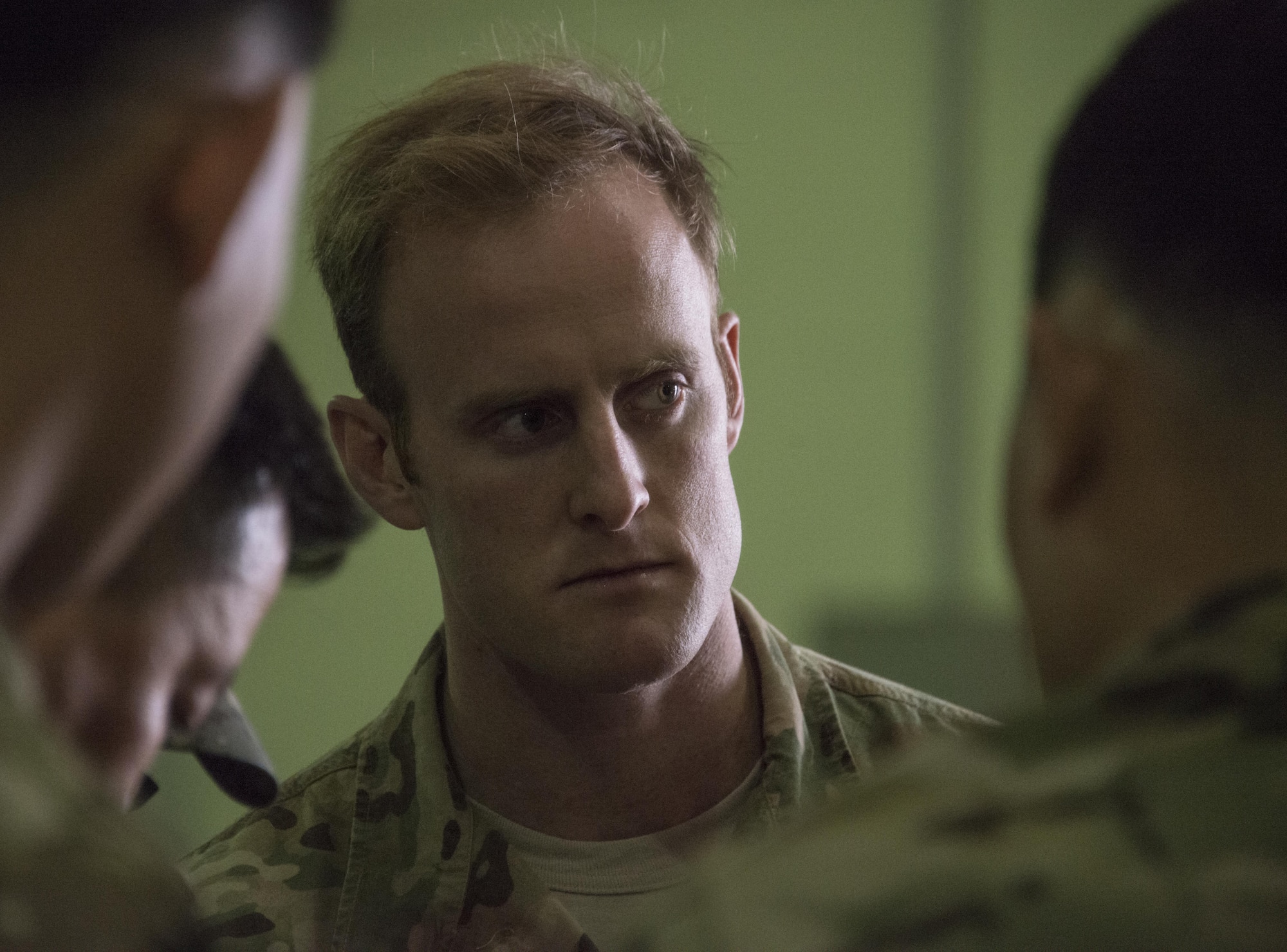 A U.S. Air Force 320th Special Tactics Squadron special tactics officer listens to his counterparts from the Republic of Korea 255th Special Operations Squadron during a briefing on airborne operations, March 24, 2017 at Daegu Air Base, ROK. Foal Eagle 2017 provided an opportunity for the 320th STS to advance interoperability and increase partner capacity by planning and executing complex training missions with multiple joint and combined units. (U.S. Air Force photo by Capt. Jessica Tait)