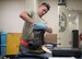 U.S. Air Force Senior Airman Joshua Cox, 18th Component Maintenance Squadron hydraulics technician, tightens a medium pressure rubber hose assembly May 2, 2017, at Kadena Air Base, Japan. Hydraulics Airmen often rely on several shifts in order to complete repairs in a timely fashion, such as having one shift disassembling and inspecting a part and the next shift reassembling and testing the part. (U.S. Air Force photo by Senior Airman John Linzmeier)