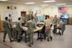 The 18th Component Maintenance Squadron hydraulics day-shift team gathers for a meeting May 2, 2017, at Kadena Air Base, Japan. All functioning aircraft in the Air Force are supported by a team of hydraulics Airmen who spend years developing their troubleshooting and repair capabilities with the help of a mentor. (U.S. Air Force photo by Senior Airman John Linzmeier)