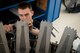 U.S. Air Force Airman 1st Class Jacob Bolanos, 18th Component Maintenance Squadron aerospace propulsion technician, services an F-15 Eagle engine augmenter May 12, 2017, at Kadena Air Base, Japan. The aerospace propulsion flight is responsible for rebuilding, repairing and performing preventative maintenance on engines in order to prepare them for flight. (U.S. Air Force photo by Senior Airman John Linzmeier)