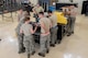 A team of aerospace propulsion technicians from the 18th Component Maintenance Squadron gather around a workbench May 12, 2017, at Kadena Air Base, Japan. The Airmen worked together to prepare an F-15 Eagle engine for a trial run at the test cell. (U.S. Air Force photo by Senior Airman John Linzmeier)