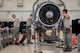 A team of aerospace propulsion technicians from the 18th Component Maintenance Squadron service an F-15 Eagle engine May 12, 2017, at Kadena Air Base, Japan. The Airmen worked together to prepare an F-15 Eagle engine for a trial run at the test cell. (U.S. Air Force photo by Senior Airman John Linzmeier)