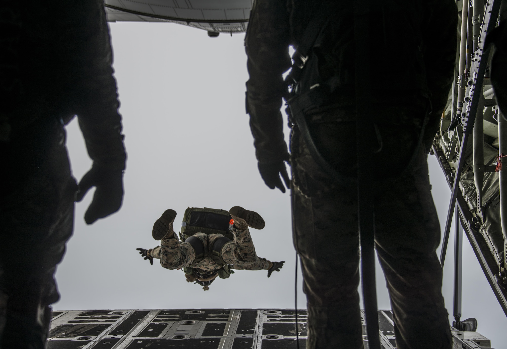 U.S. Marine Corps III Marine Expeditionary Force operators perform military free fall operations from a U.S. Air Force MC-130J Commando II assigned to the 17th Special Operations Squadron, March 25, 2017 over the Republic of Korea peninsula. The daily airborne operations executed during Foal Eagle 2017 further developed the integration of special operations forces and operational capability through scenario-based missions. (U.S. Air Force photo by Capt. Jessica Tait)