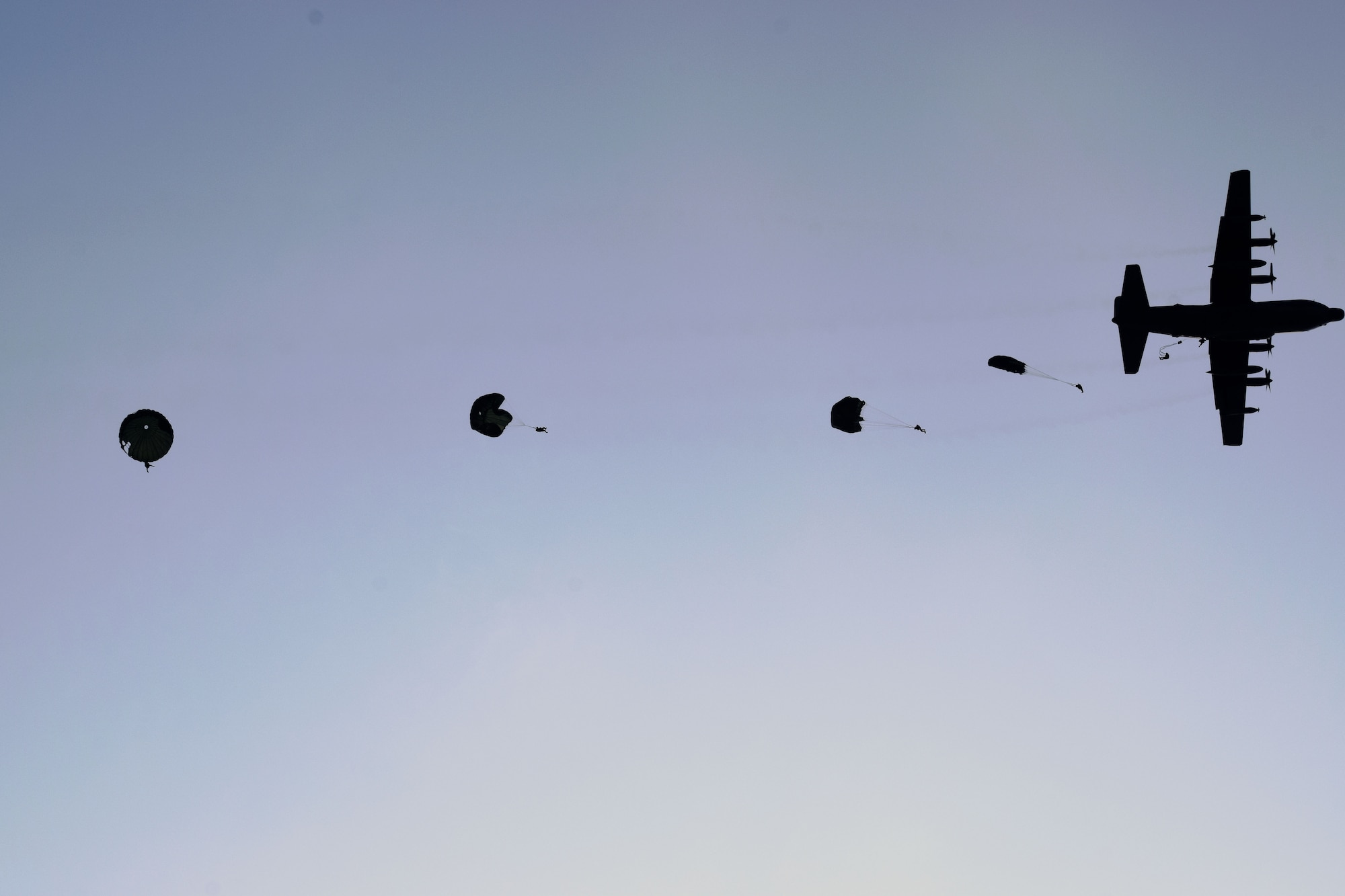 A U.S. Air Force MC-130H Combat Talon II assigned to the 1st Special Operations Squadron drops jumpers from the Republic of Korea Special Warfare Command during a combined airborne operation, March 31, 2017 at Kunsan Air Base, ROK. Throughout Foal Eagle 2017, the 1st SOS and 17th SOS provided specialized aviation to members of the ROK Air Force 255th SOS, ROK Special Warfare Command, U.S. Marine Corps III Marine Expeditionary Force and U.S. Air Force 320th Special Tactics Squadron. (Courtesy photo)