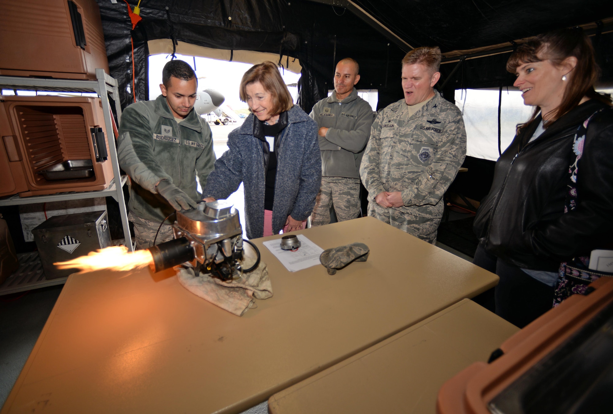 Georgina Holloway, 100th Air Refueling Wing Honorary Commander test out a babington airtronic burner May 9, 2017, on RAF Mildenhall, England. During Honorary Commanders’ Day, squadrons demonstrate and brief honorary commanders on the RAF Mildenhall mission, vision and priorities on RAF Mildenhall. (U.S. Air Force photo by Senior Airman Christine Groening)