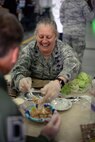 U.S. Air Force Lt. Col. Jennifer Neris, 100th Logistics Readiness Squadron commander, helps her honorary commander create a gourmet dessert during a Meal Ready to Eat Bake-off Event for Honorary Commanders’ Day, May 9, 2017, on RAF Mildenhall, England. Base leadership and their honorary commanders were tasked to create a main dish, side dish, dessert and drink with two MREs. (U.S. Air Force photo by Senior Airman Christine Groening)
