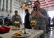 U.S. Air Force Master Sgt. Mati Ochoa, 100th Air Refueling Wing NCO in charge of protocol, takes a photo of a team’s gourmet dish from the Meal to Read to Eat Bake-Off competition May 9, 2017, on RAF Mildenhall, England. Ochoa was one of three judges who assessed dishes on appearance, taste and creativity. (U.S. Air Force photo by Senior Airman Christine Groening)