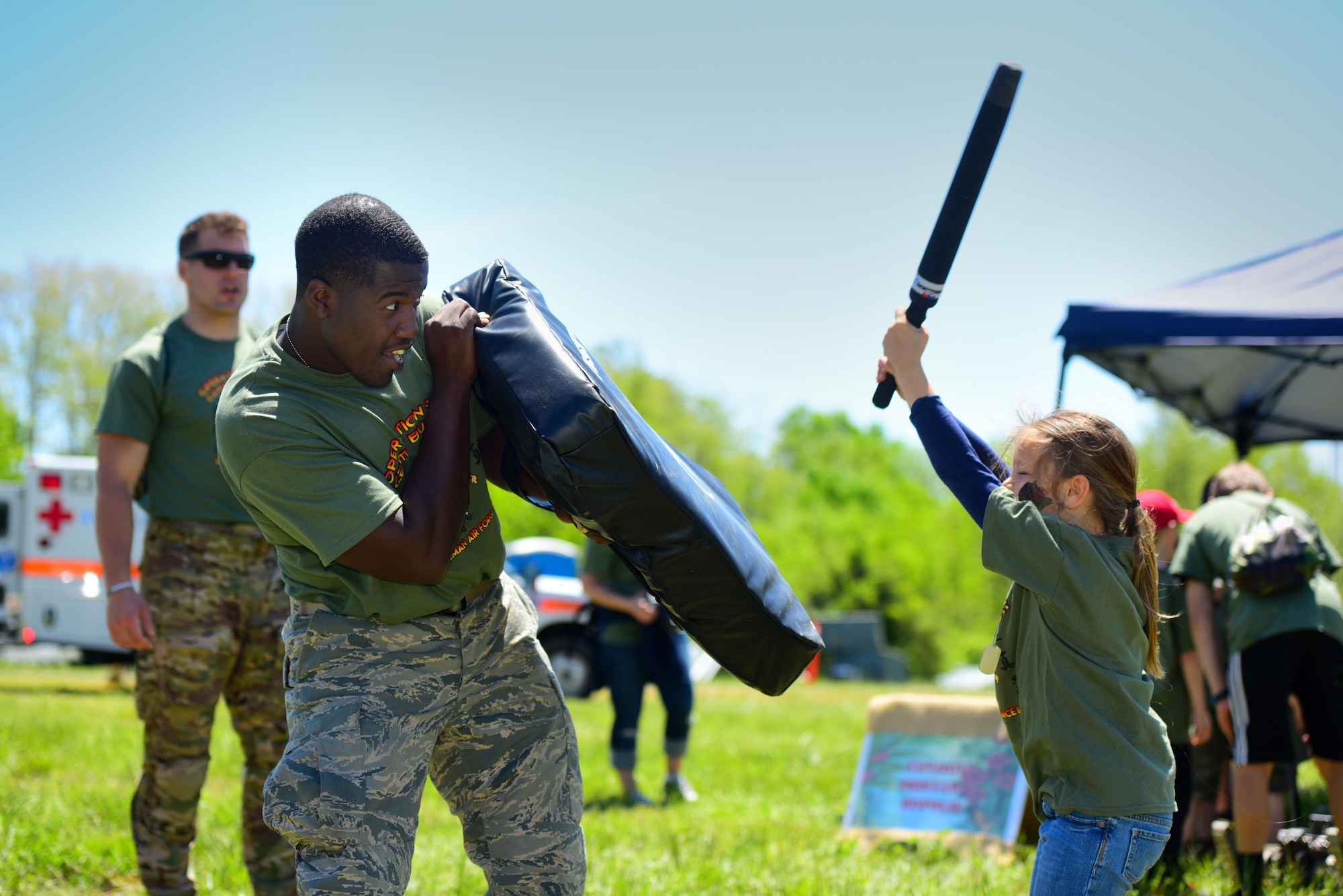 Members of Team Whiteman participate in various activities during a mock deployment, known as Operation Spirit, held at Whiteman Air Force Base, Mo., May 6, 2017. Participants had the opportunity to go through the deployment center line, pose for a photo in front of a B-2 Spirit, and advance to the obstacle course, where they also had the opportunity to get hands-on learning about several units on base. (U.S. Air Force photos by Airman 1st Class Jazmin Smith)