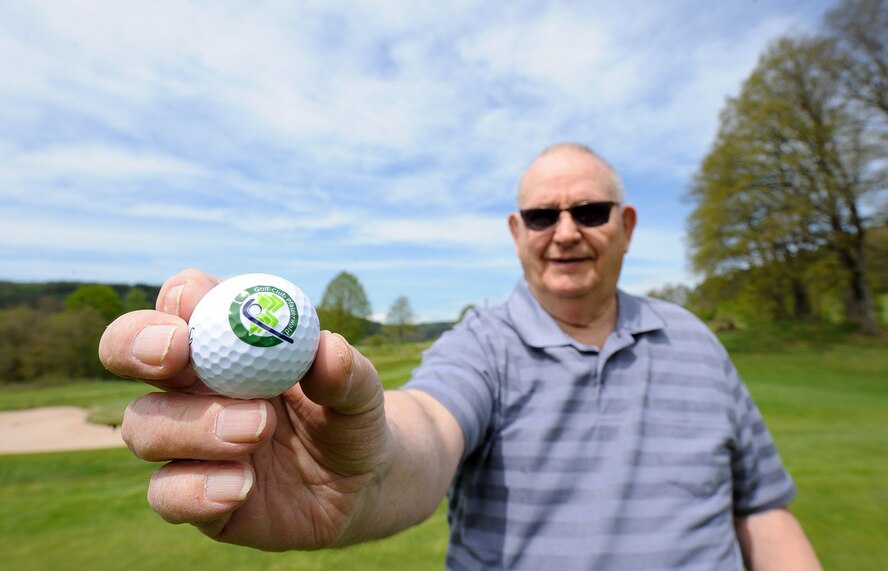 Retired Chief Master Sgt. Charles E. Milam holds a Golf-Club Pfälzerwald e.V. ball at the Golf-Club Pfälzerwald e.V. in Waldfischbach-Burgalben, Germany, May 11, 2017. In 1966, Milam was awarded the Air Force Commendation Medal for building a control panel out of wiring, switches, and colored light-emitting diodes that, with a realistic script, later became the simulator used by the security police controllers working at launch facilities. (U.S. Air Force photo by Airman 1st Class Savannah L. Waters)