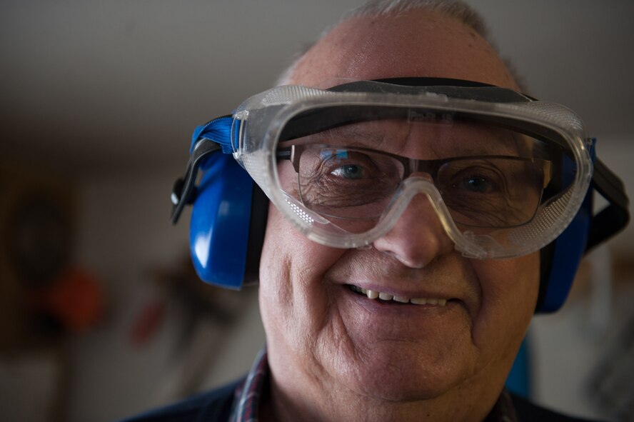 Retired Chief Master Sgt. Charles E. Milam smiles while working in his woodshop in Waldfischbach-Burgalben, Germany, May 2, 2017. During his 30 years of active-duty service, Milam was awarded the Bronze Star for his valor and meritorious service while he had administrative supervision over 11 Airmen assigned to security for the Presidential Advisor on Vietnam Affairs. He also trained Vietnamese guards who provided security for the embassy housing during his second Vietnam tour. (U.S. Air Force photo by Airman 1st Class Savannah L. Waters)