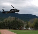A Colorado National Guard Black Hawk helicopter crew from Buckley Air Force Base, Aurora, Colo., assists with evacuations during the Beulah Flood in Pueblo County, May 11, 2017. 