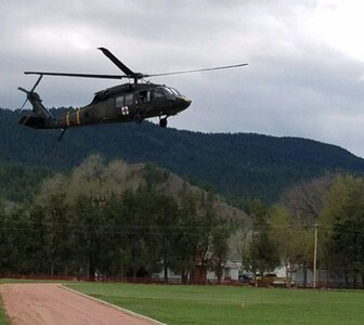 A Colorado National Guard Black Hawk helicopter crew from Buckley Air Force Base, Aurora, Colo., assists with evacuations during the Beulah Flood in Pueblo County, May 11, 2017. 