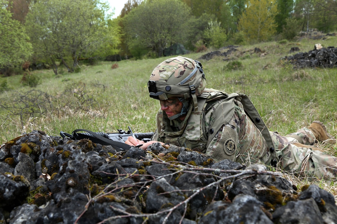 Army Chief Warrant Officer 3 Michael Gudundson performs surveillance tasks while providing security during Saber Junction 17 at the Hohenfels Training Area, Germany, May 4, 2017. Gudundson is assigned to the Regimental Engineer Squadron, 2d Cavalry Regiment. Army photo by Sgt. John Cress Jr.