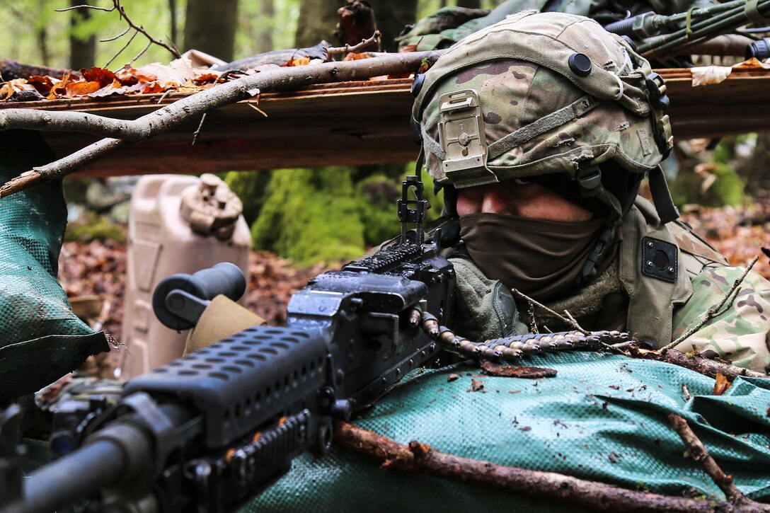 A soldier scans his sector of fire while conducting defensive operations during Saber Junction 17 at the Hohenfels Training Area, Germany, May 5, 2017. Army photo by Sgt. Matthew Hulett