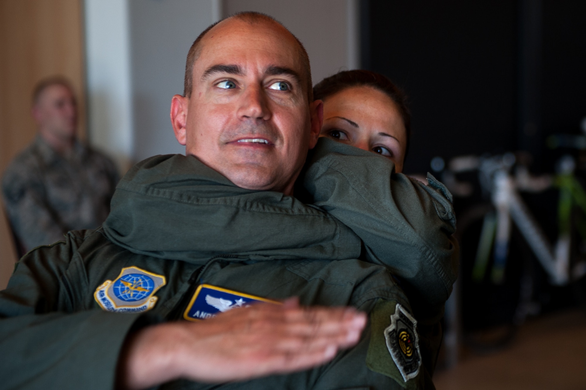 U.S. Air Force Tech. Sgt. Rosalin Panek, 76th Airlift Squadron flight attendant, puts Col. Andrew Purath, senior developmental student, in a choke hold during combat survival training on Ramstein Air Base, Germany, May 10, 2017. The combative training was part of the Survival Evasion Resistance and Escape refresher course for aircrew members on base. (U.S. Air Force photo by Senior Airman Devin Boyer/Released)