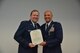 During his final commander's call, Major General Richard Scobee, Tenth Air Force Commander, presented the Aerial Achievement Medal to Major Brandon McRay, Tenth Air Force Remotely Piloted Aircraft Staff Training Officer, for aerial accomplishments in support of ongoing contingency operations.