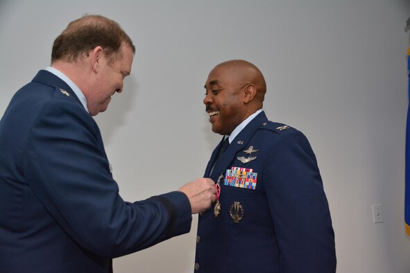 During his final commander's call, Major General Richard Scobee, Commander, Tenth Air Force, presented the Legion of Merit to Colonel Lloyd Terry Jr., special assistant and cyber operations advisor to the Tenth Air Force commander for exceptionally meritorious service while he served as the Commander, 960th Cyber Operations Group.