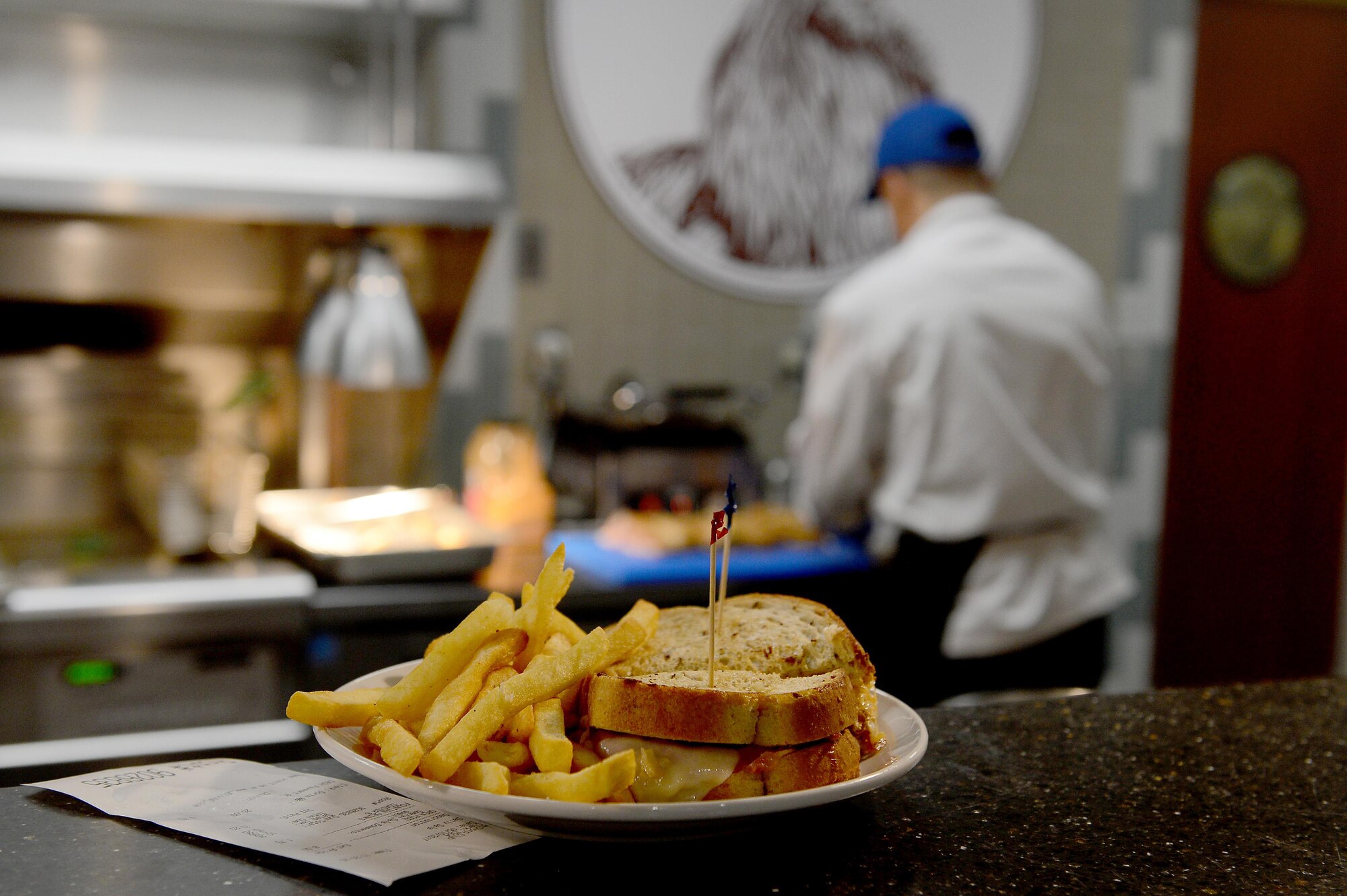 A reuben sandwich, prepared by Derek Torrence, McChord Club executive chef, waits to be picked up at McChord Grill, May 10, 2017 at Joint Base Lewis-McChord, Wash. Torrence was afforded the chance to make his dream of becoming a chef real when he went to Culinary Arts School and graduated from Johnson & Wales University in 2008. (U.S. Air Force photo/Senior Airman Divine Cox)