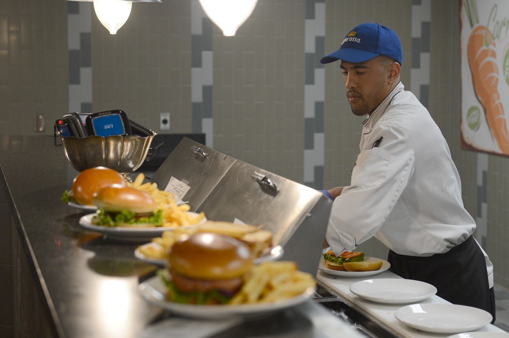 Derek Torrence, McChord Club executive chef, prepares a sandwich during lunch at McChord Grill, May 10, 2017 at Joint Base Lewis-McChord, Wash. Torrence has been the executive chef at McChord since May 2015. (U.S. Air Force photo/Senior Airman Divine Cox)