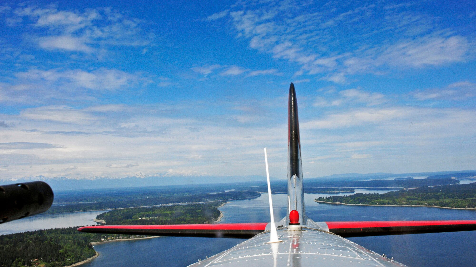 Aluminum Overcast, a 77-year-old B-17 carrying passengers from the local community and WWII veterans, flies over the Puget Sound, May 10, 2017 in Olympia, Wash. Of the 12,732 B-17s produced between 1935 and 1945, 4,735 were lost in combat. (U.S. Air Force photo by Staff Sgt. Whitney Amstutz)