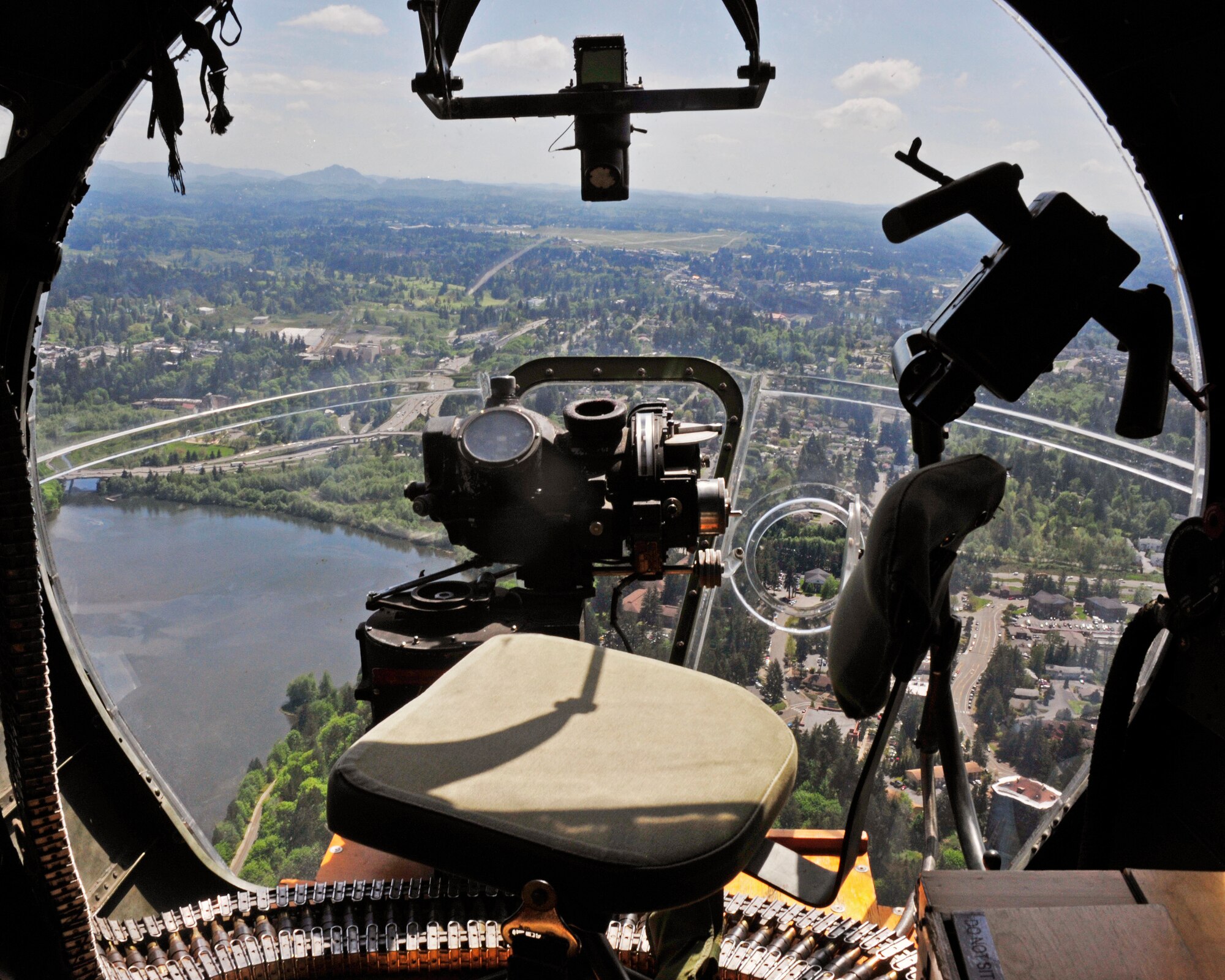 A B-17 Flying Fortress, flies over Olympia, Wash., May 10, 2017. The nose turret, where the navigator and bombardier traditionally sat, is accessible through a small passageway under the pilot’s seats and yields unencumbered views. (U.S. Air Force photo by Staff Sgt. Whitney Amstutz)