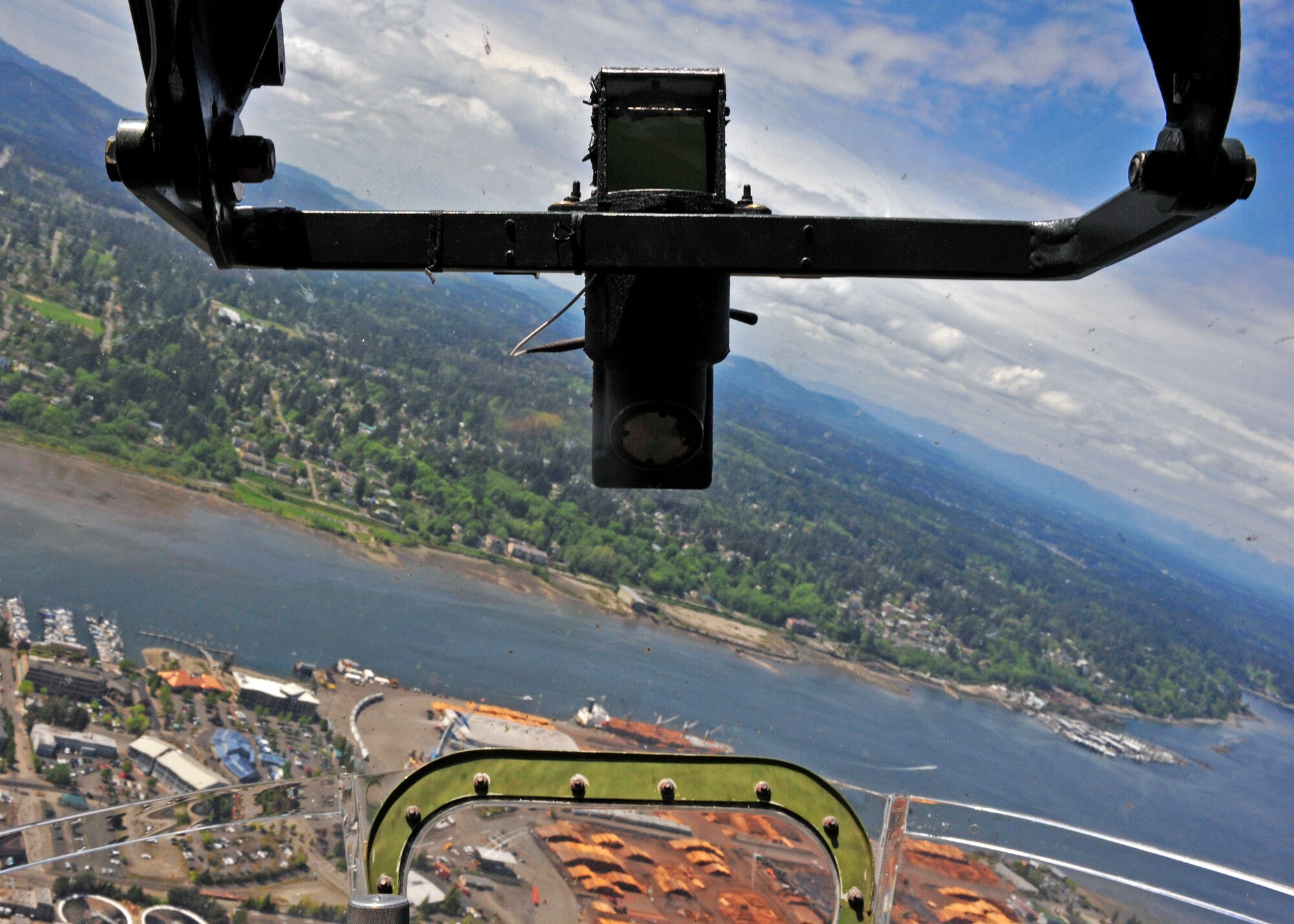 A 77-year-old B-17 nicknamed Aluminum Overcast flies over Olympia, Wash., May 10, 2017. During WWII, the B-17 had a crew of 10 men, a maximum speed of 287 miles per hour, and a maximum ceiling of 35,600 feet. (U.S. Air Force photo by Staff Sgt. Whitney Amstutz)