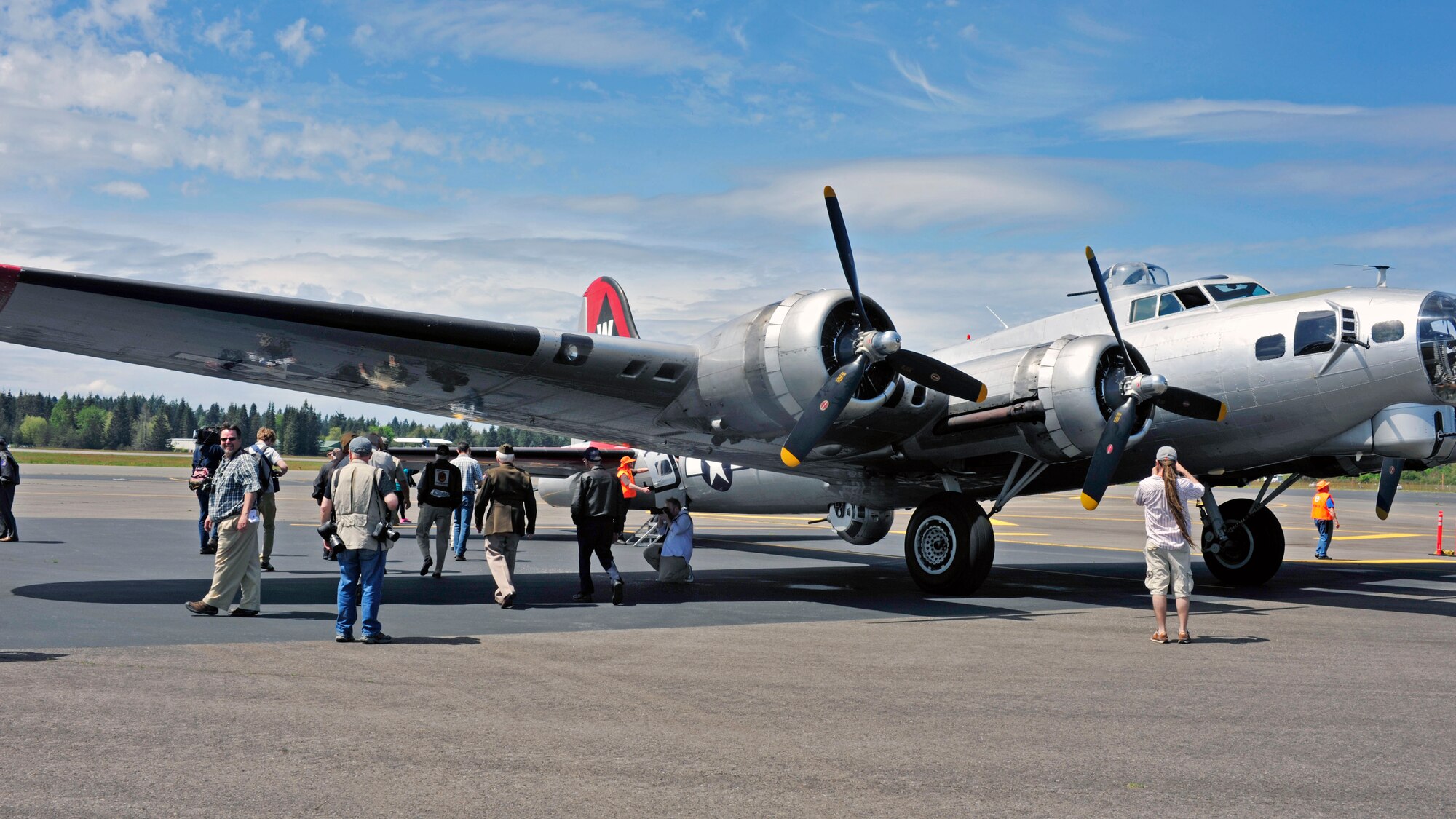 A fully-restored B-17 Flying Fortress nicknamed Aluminum Overcast sits on the runway at the Olympic Flight Museum, May 10, 2017 in Tumwater, Wash. Members of the media had the opportunity to fly on the historic aircraft and speak to veterans who either worked on, or flew the B-17 during WWII. (U.S. Air Force photo by Staff Sgt. Whitney Amstutz)