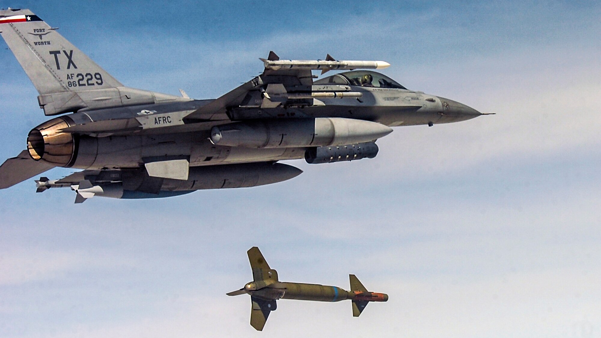 An F-16 Fighting Falcon aircraft from Naval Air Station Fort Worth Joint Reserve Base, Texas, drops a GBU-24 over the Utah Test and Training Range, May 2. Airmen and aircraft from several bases participated in Combat Hammer, a precision-guided air-to-ground weapons evaluation exercise hosted by the 86th Fighter Weapons Squadron at Hill Air Force Base, Utah. (U.S. Air Force/86th Fighter Weapons Squadron)