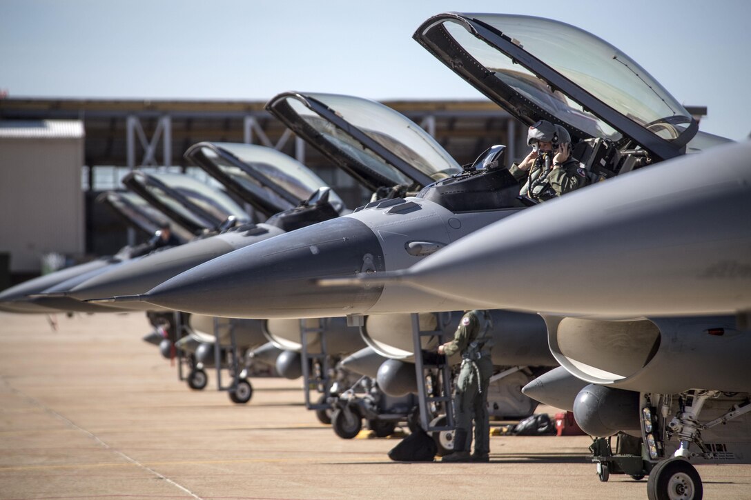 An F-16 Fighting Falcon pilot from the 301st Fighter Wing, Naval Air Station Fort Worth Joint Reserve Base, Texas, prepares for flight at Hill Air Force Base, Utah, May 3. Airmen and aircraft from several bases participated in Combat Hammer, a two-week long exercise which evaluates precision-guided air-to-ground weapons for reliability, maintainability, suitability and accuracy. (U.S. Air Force/Paul Holcomb)
