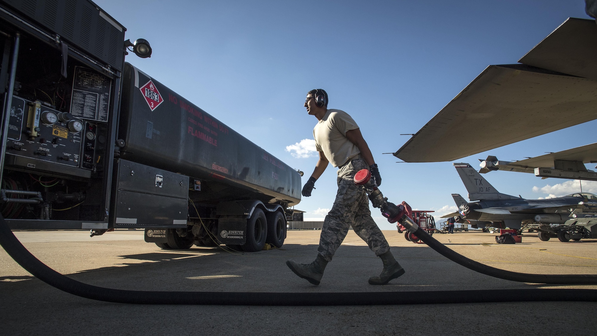 Senior Airman Tanzim Chowdhury, a Petroleum, Oils and Lubricants (POL) specialist assigned to the 301st Logistics Readiness Squadron, Naval Air Station Fort Worth Joint Reserve Base, Texas, refuels F-16 Fighting Falcon aircraft at Hill Air Force Base, Utah, May 9. Chowdhury along with Airmen and Aircraft from NAS Fort Worth Joint Reserve Base, Moody AFB, Georgia, and Hickam AFB, Hawaii, participated in Combat Hammer, a twice annual precision-guided air-to-ground weapons evaluation exercise conducted at Hill AFB and the Utah Test and Training Range. (U.S. Air Force/Paul Holcomb)