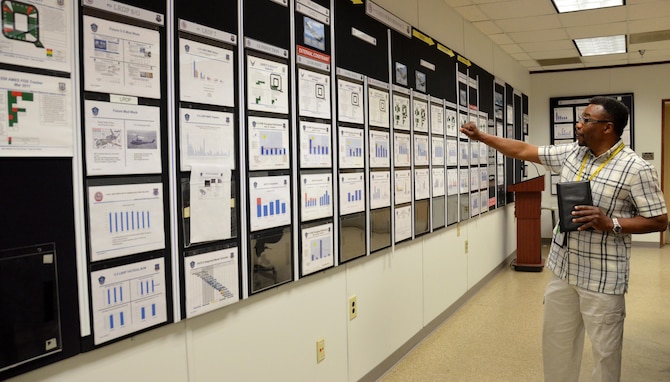 Osbin Clark, Supervisory Production and Material Support chief, explains the various stages of Program Depot Maintenance for the C-5 on Robins Air Force Base, Ga., May 3, 2017. (U.S. Air Force photo by Tech. Sgt. Kelly Goonan)