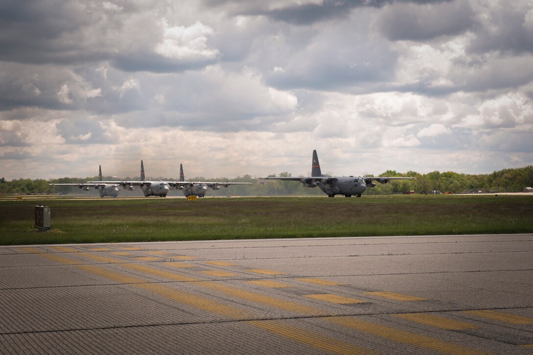 A C-130H Hercules aircraft assigned to the 182nd Airlift Wing, Illinois Air National Guard, takes off in a four-plane formation training during drill weekend in Peoria, Ill., May 6, 2017. The C-130 is capable of airdropping troops and equipment into hostile areas while operating in inclement terrain. (U.S. Air National Guard photo by Tech. Sgt. Lealan Buehrer)