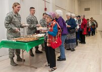 Airmen serve food at the Salute to Seniors event in Minot, N.D., May 9, 2017. Minot Air Force Base volunteers helped with security, serving food and drinks, handing out gifts, and escorting senior citizens to designated areas. (U.S. Air Force photo/Airman 1st Class Jonathan McElderry)