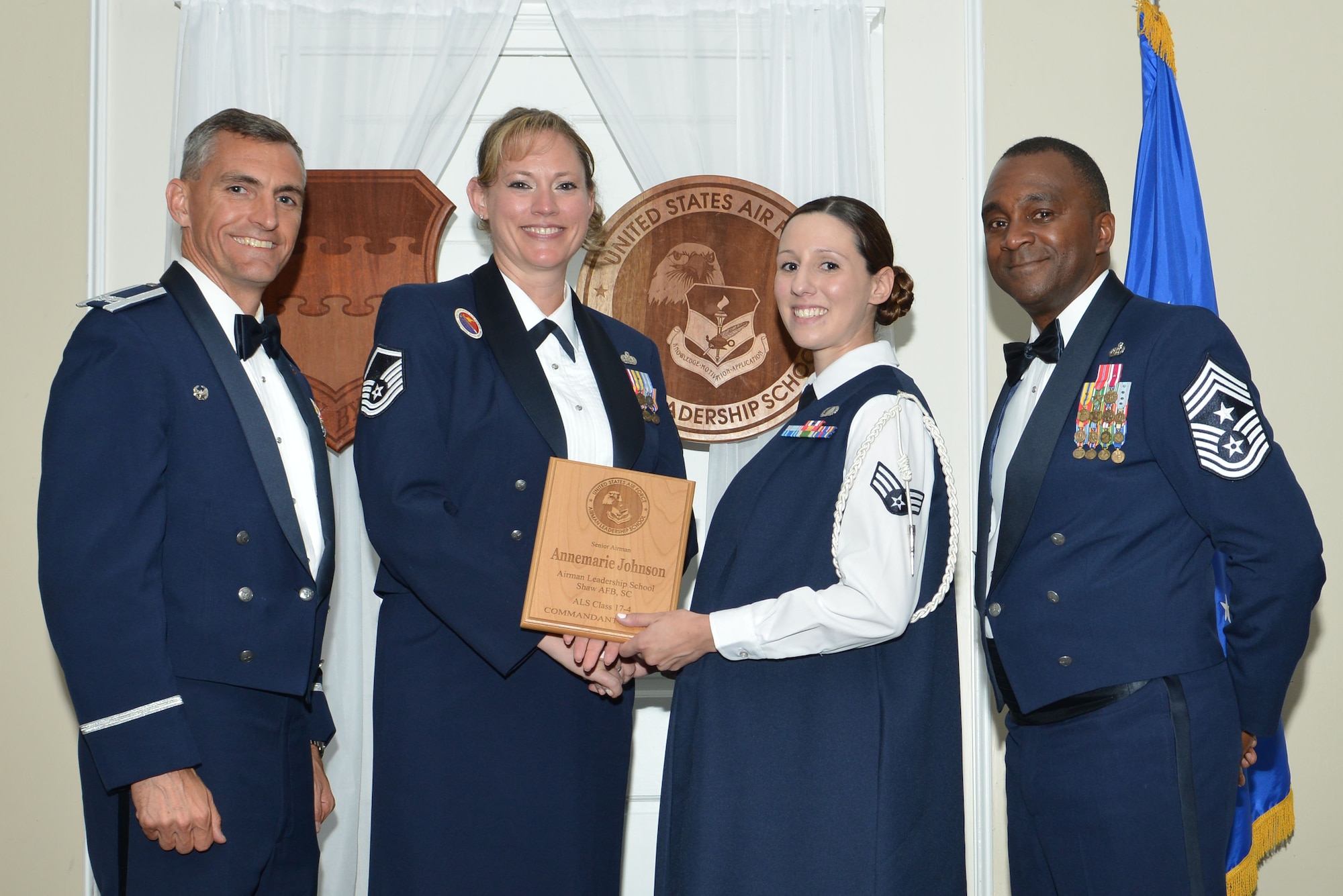 U.S. Air Force Senior Airman Annemarie Johnson, 480th Intelligence, Surveillance and Reconnaissance Group, receives the Senior Master Sgt. David B. Reid Airman Leadership School (ALS) Commandant’s Award during the ALS Class 17-4 graduation ceremony at Shaw Air Force Base, S.C., May 11, 2017. The Commandant’s award is given to the student who most exemplifies professional military qualities and is chosen by their peers, their primary instructors, and the ALS commandant. (U.S. Air Force photo by Airman 1st Class Destinee Sweeney)
