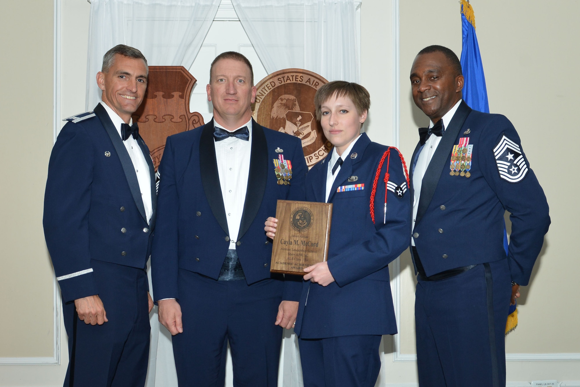 U.S. Air Force Senior Airman Cayla M. McCord, 31st Intelligence Squadron, receives the Senior Master Sgt. David B. Reid Airman Leadership School (ALS) Academic Achievement award during the ALS Class 17-4 graduation ceremony at Shaw Air Force Base, S.C., May 11, 2017. This award is given to the student with the highest point total. (U.S. Air Force photo by Airman 1st Class Destinee Sweeney)