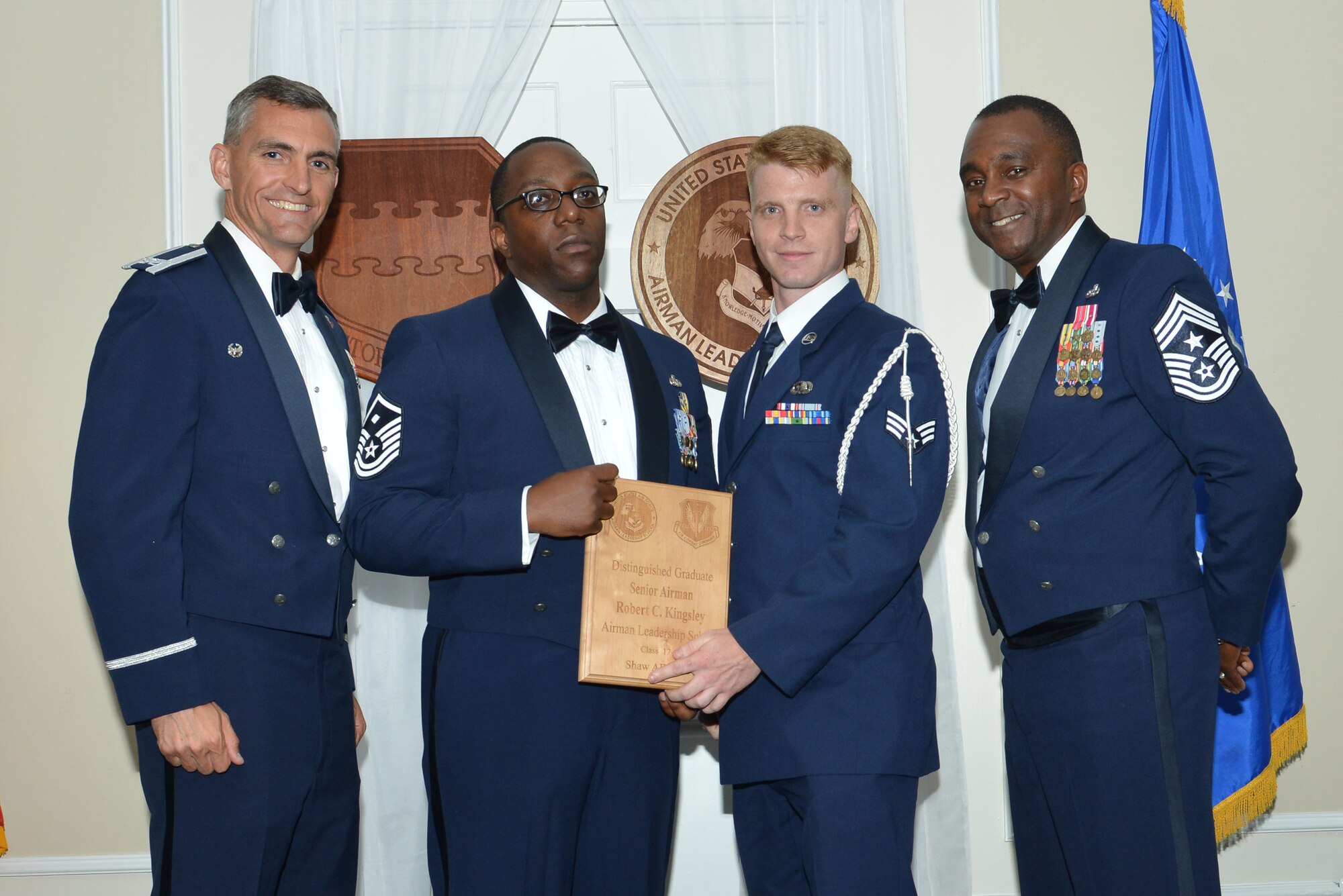 U.S. Air Force Senior Airman Robert C. Kingsley, 3rd Intelligence Squadron, receives a distinguished graduate award for 17-4 of the Senior Master Sgt. David B. Reid Airman Leadership School Class, at Shaw Air Force Base, S.C., May 11, 2017. Distinguished graduate awards are given to the top 10 percent of the class for total point accumulation. (U.S. Air Force photo by Airman 1st Class Destinee Sweeney)