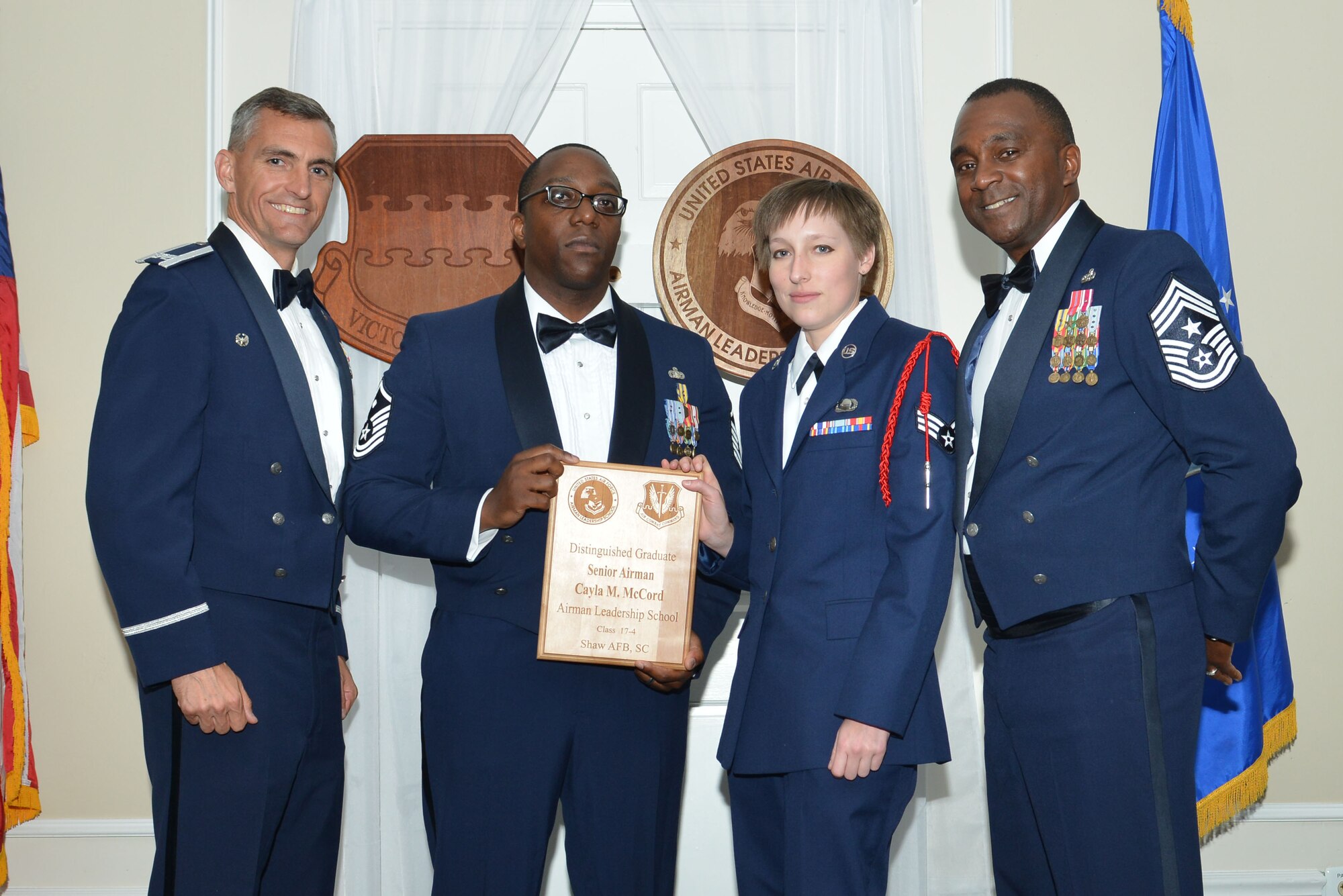 U.S. Air Force Senior Airman Cayla M. McCord, 31st Intelligence Squadron, receives a distinguished graduate award for Class 17-4 of the Senior Master Sgt. David B. Reid Airman Leadership School, at Shaw Air Force Base, S.C., May 11, 2017. Distinguished graduate awards are given to the top 10 percent of the class for total point accumulation. (U.S. Air Force photo by Airman 1st Class Destinee Sweeney)