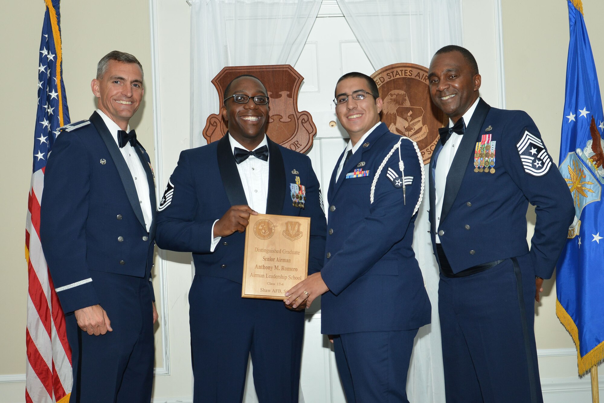 U.S. Air Force Senior Airman Anthony M. Romero, 316th Fighter Squadron, receives a distinguished graduate award for Class 17-4 of the Senior Master Sgt. David B. Reid Airman Leadership School, at Shaw Air Force Base, S.C., May 11, 2017. Distinguished graduate awards are given to the top 10 percent of the class for total point accumulation. (U.S. Air Force photo by Airman 1st Class Destinee Sweeney)