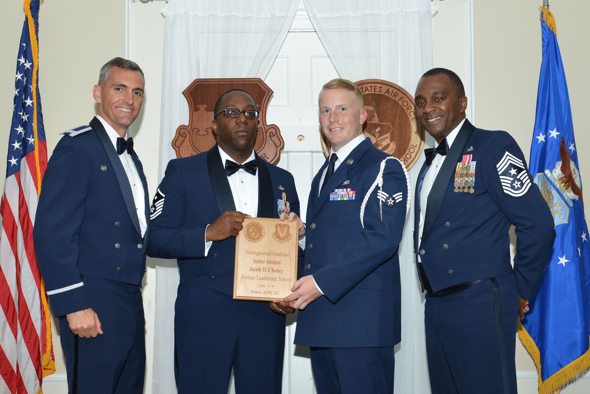 U.S. Air Force Senior Airman Jacob D. Chaney, 20th Logistics Readiness Squadron, receives a distinguished graduate award for Class 17-4 of the Senior Master Sgt. David B. Reid Airman Leadership School, at Shaw Air Force Base, S.C., May 11, 2017. Distinguished graduate awards are given to the top 10 percent of the class for total point accumulation. (U.S. Air Force photo by Airman 1st Class Destinee Sweeney)