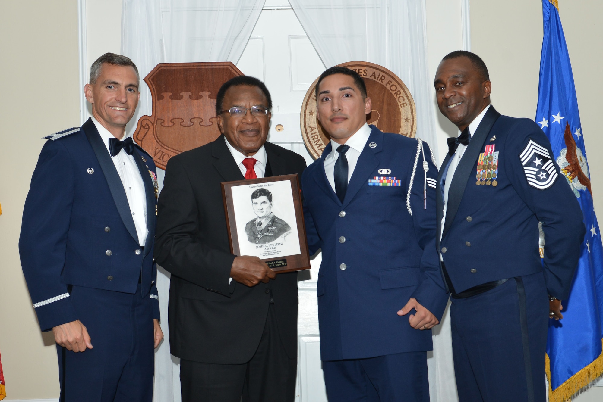 U.S. Air Force Senior Airman Michael A. Gomez, 20th Operations Support Squadron, receives the John L. Levitow Award for Class 17-4 of the Senior Master Sgt. David B. Reid Airman Leadership School, at Shaw Air Force Base, S.C., May 11, 2017. The Levitow Award is given to the graduate with the highest average of instructor and student points, and is the highest award in enlisted professional military education. (U.S. Air Force photo by Airman 1st Class Destinee Sweeney)
