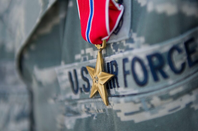 A 779th Medical Group member is presented with a Bronze Star Medal during a commander's call at Joint Base Andrews, Md., May 3, 2017. The individuals in the group were each presented a medal for their life saving work during a recent deployment. (Photo by Senior Master Sgt. Adrian Cadiz)