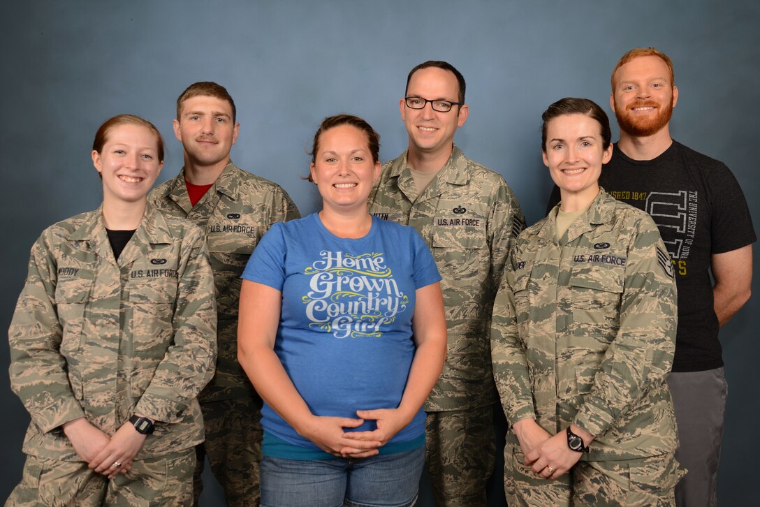 U.S. Airmen and their spouses gather for a photo on Military Spouse Appreciation Day at Shaw Air Force Base, S.C., May 12, 2017. The support and encouragement military spouses provide, as well as the sacrifices they make, help service members remain resilient, ready and focused on completing their missions. (U.S. Air Force photo by Airman 1st Class Kathryn R.C. Reaves)